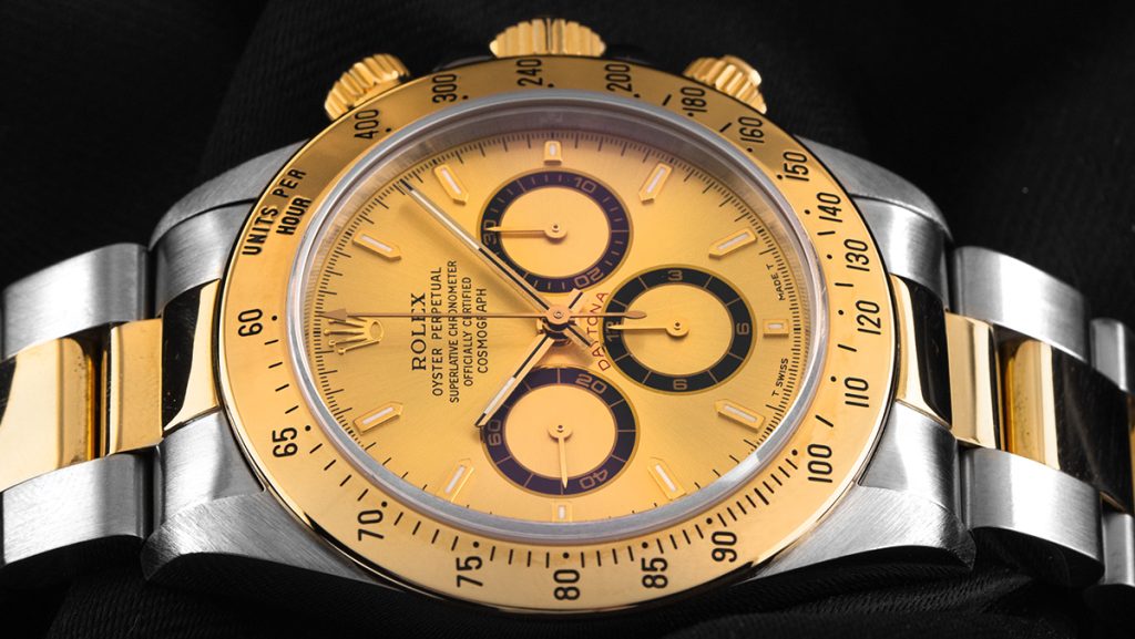 Gold-silberne Rolex Daytona mit goldenem Zifferblatt und Lünette
