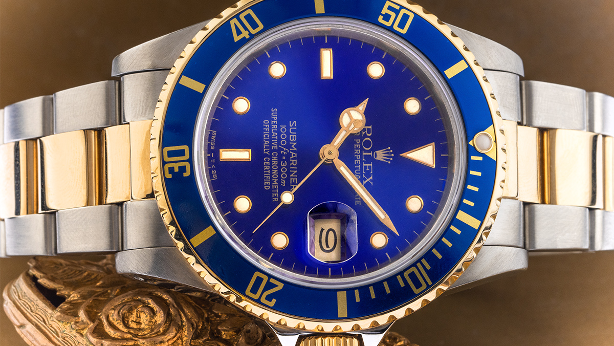 Rolex Submariner Date mit blau-goldenem Zifferblatt und silber-goldenem Armband