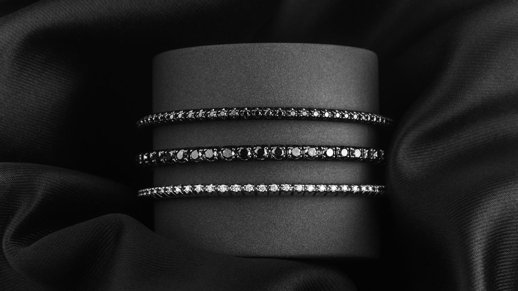 Auswahl aus drei Tennisarmbänder mit schwarzen Diamanten