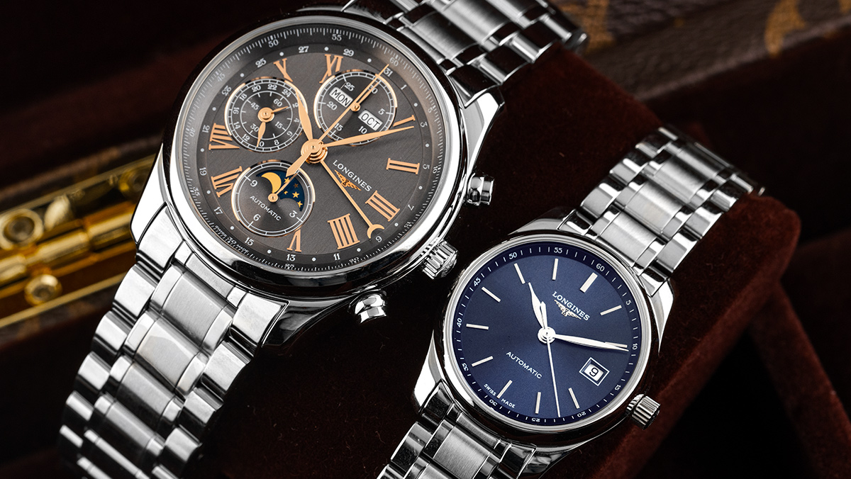 Herrenuhr von Longines und kleinere Damenuhr von Longines nebeneinander als Partneruhr