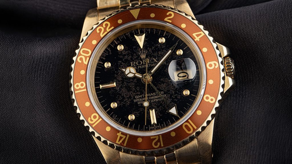 Goldene Rolex Vintage-Uhr mit Patina-Zifferblatt