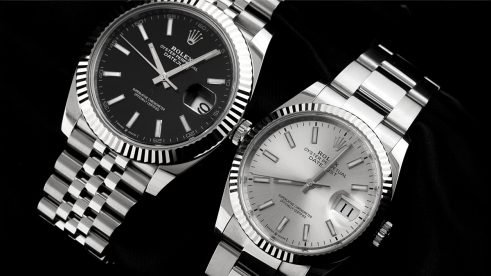 Zwei Rolex Datejust nebeneinander, eine mit schwarzem & eine mit weißem Ziffernblatt