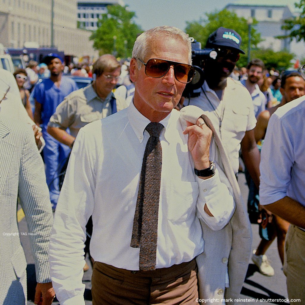 Paul Newman mit Rolex-Uhr am Handgelenk in der Stadt