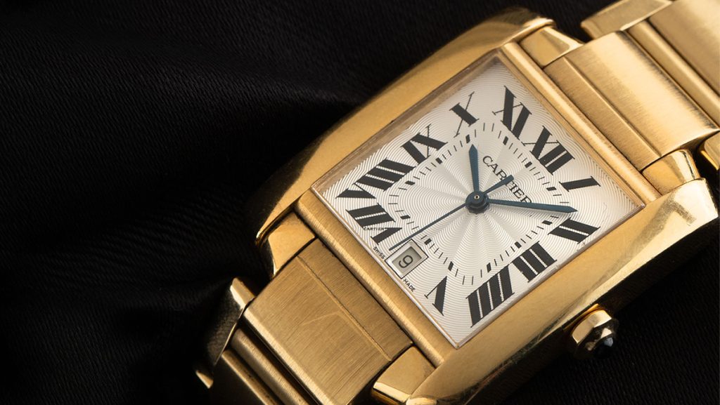 Goldene Cartier Tank mit römischen Ziffern