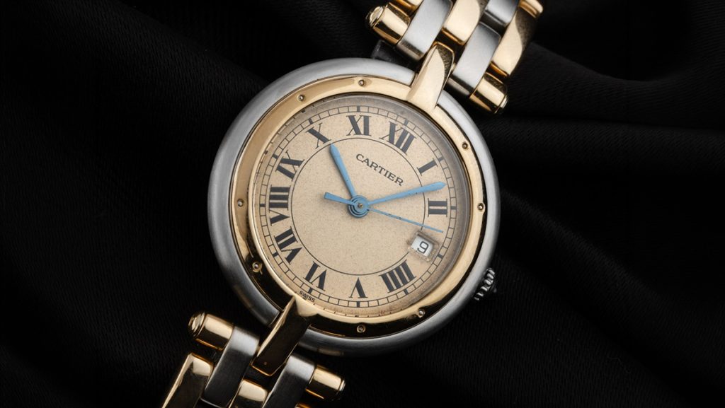 Runde Cartier Uhr mit beweglichem Glied und Details in gold-silber